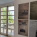 Paneles con portadas de prensa histórica en la cafetería del Parlamento de Cantabria