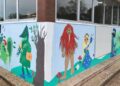 Mural infantil sobre patrimonio cántabro en un colegio